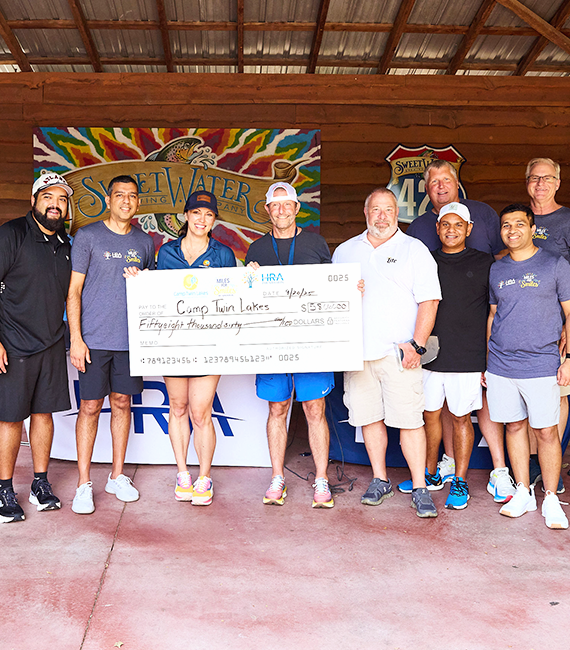HRA Foundation presenting a donation check to Camp Twin Lakes